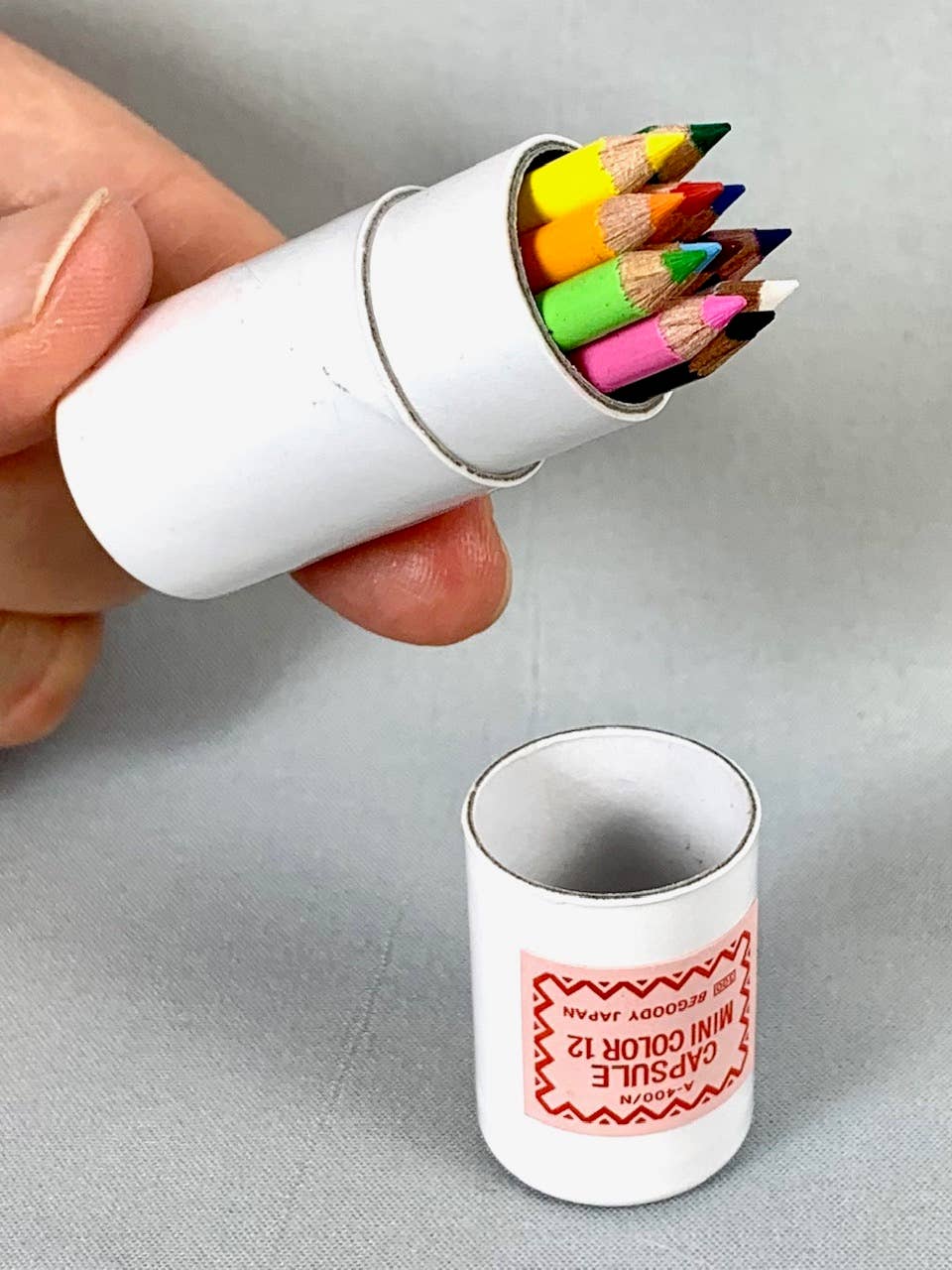 12 mini pencils in mini paper tube